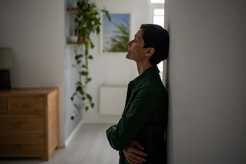 Older woman with short hair in need of a self harm rehab centers in california