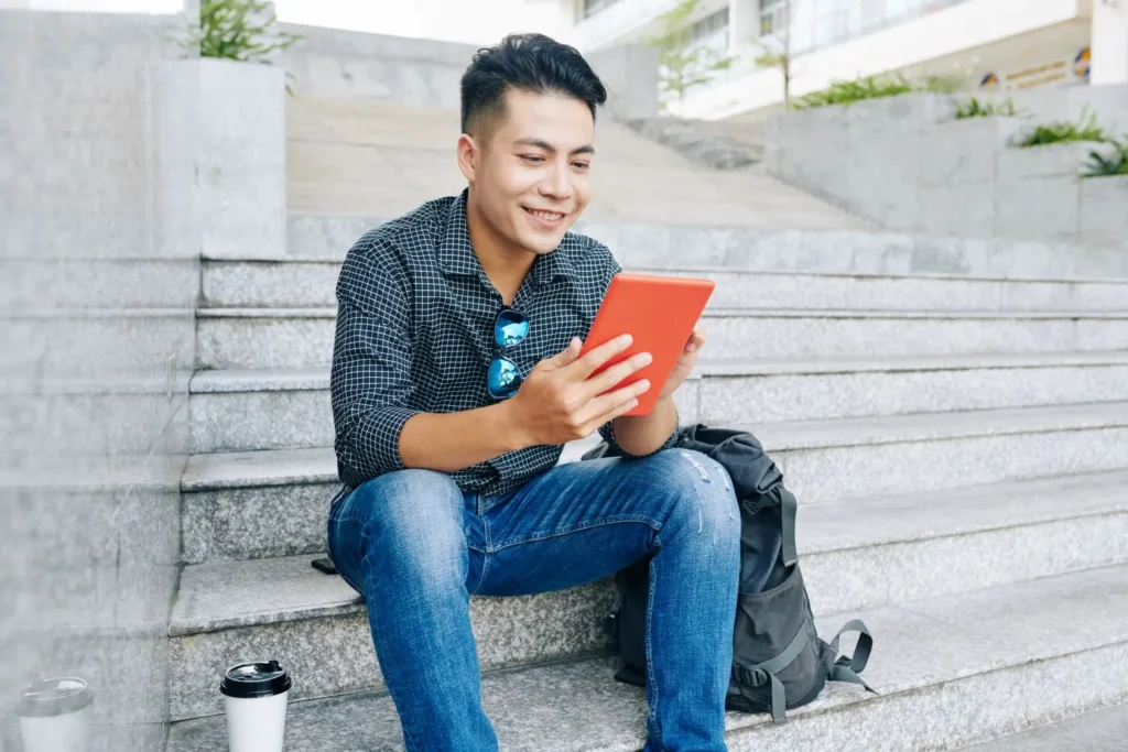 man reading a tablet in a cocaine addiction treatment program in california.